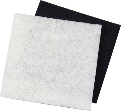Close-up of two rectangular sheets, one white textured and one black smooth, stacked at an angle.